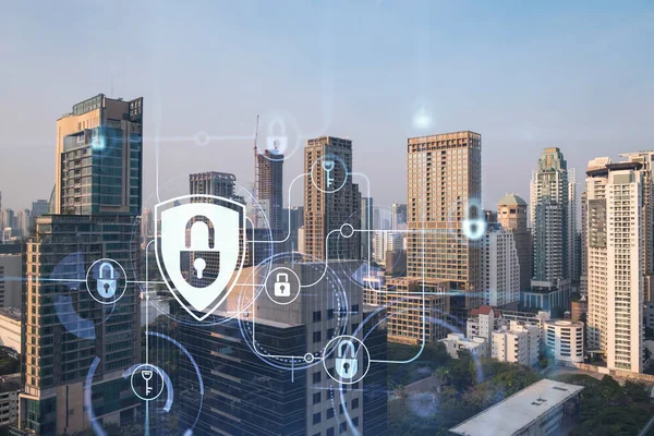 Güneydoğu Asya, Bangkok 'un günbatımı panoramik şehir manzarasında Padlock' un hologramı. Siber güvenlik istihbaratı kavramı. Çoklu pozlama.