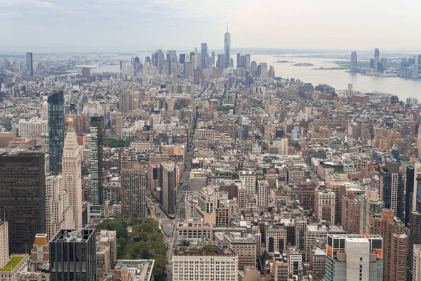 Aerial panoramic city view of Lower Manhattan , Midtown, Downtown, Financial district and West Side at day time, NYC, USA. New Jersey on horizon over the Hudson River. A vibrant business neighborhoods