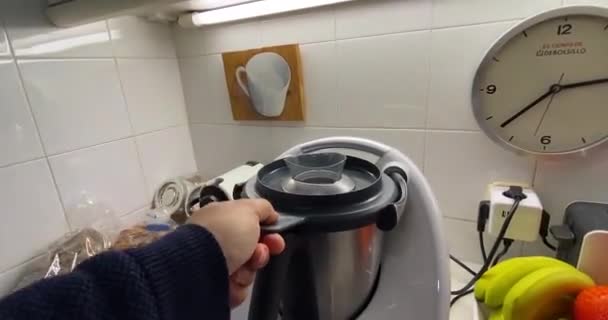 Barcelona, Spain, 5 May 2022: woman cooking food with the thermomix — Stockvideo
