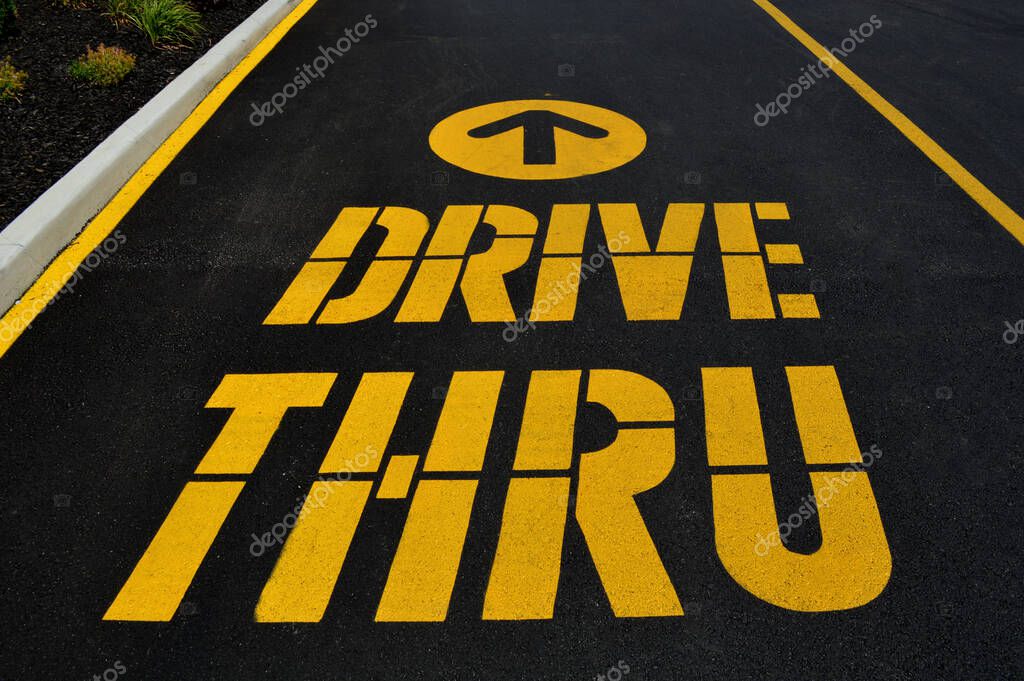 Columbus,Ohio USA - July 24, 2017: Mc Donald's Drive Thru lane. The McDonald's Corporation is the world's largest chain of hamburger fast food restaurants.