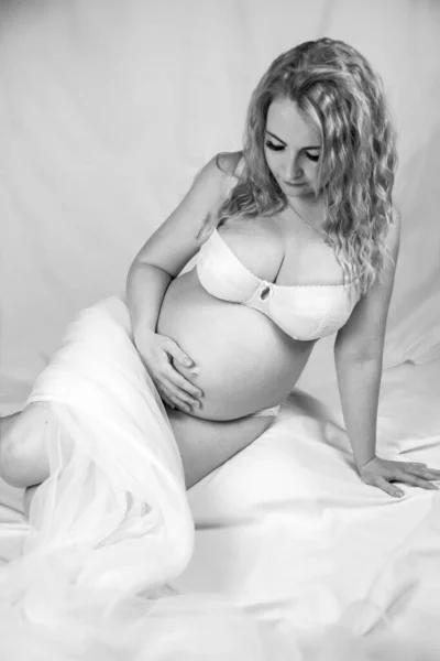Black White Portrait Pregnant Woman Sitting Floor Studio White Background — Stockfoto