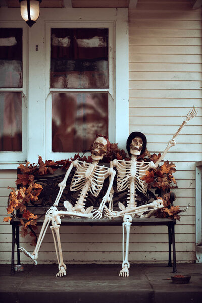 Happy married couple of skeletons. Scenery for Halloween in October. Decoration in the yard.