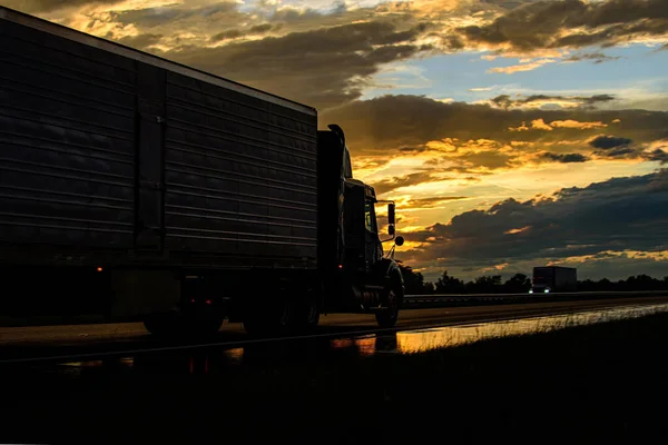 Truck at sunset. American truck on a beautiful road. All life is like a road