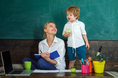 Mom and son reading.Teacher at home school. Tutor