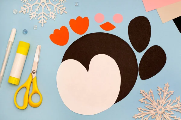 Preparing materials and tools for making childrens crafts from colored paper and cardboard. Original project for children. Step-by-step photo instructions. Kids holidays crafts.