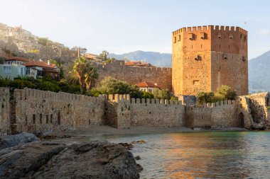 View of the fortress in Alanya, in the setting sun.
