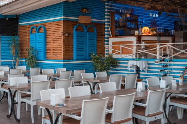 Part of the outdoor summer resort restaurant. Empty cafe, no people.