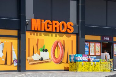 Alanya, Turkey - August 2022: A sign outside of one of the largest FMCG retail chains. Trading network Migros.