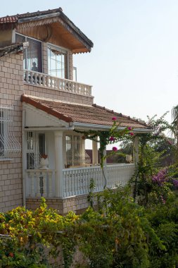 Fragment of a residential country house in the evening.