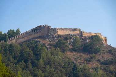 An old stone wall on top of a mountain. Fortress in Alanya.