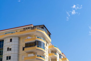 Detail of the exterior of an apartment building. Sunny day.