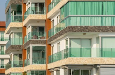 New residential building with panoramic windows. Property by the sea.