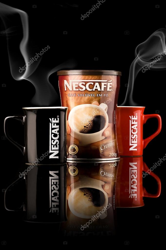 Coffee on a table top in front of a dark background