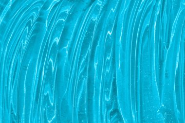 .Kabarcıklı mavi kozmetik jel dokusu. Şeffaf cilt kremi, yüz serumu, nemlendirici arka plan. Sıvı şeffaf cilt bakım ürünü örneği. Güzel hyaluronik asit