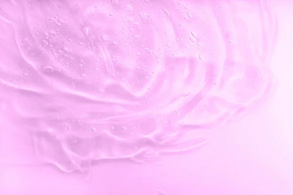 Sfondo macchia gel rosa. Acido ialuronico per la cura della pelle con collagene e retinolo. Lozione per la cura della pelle faccia campione di siero. Gel liquido trasparente crema cosmetica. — Foto Stock