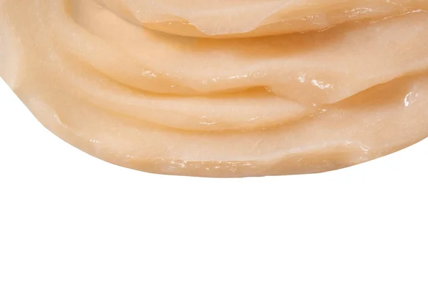 Μαλακτική κρέμα μαλλιών λεκέ Swatch σε λευκό φόντο. Κίτρινη καλλυντική λοσιόν ενυδατική κρέμα δείγμα closeup. Γαλάκτωμα σώματος, ορός ρετινόλης, κυματιστή υφή σαμπουάν. Μάσκα περιποίησης δέρματος, κρεμώδες καθαριστικό — Φωτογραφία Αρχείου