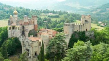 Aerial drone panoramic view of the Rocchetta Mattei castle in Italy on sunny summer day, view from above