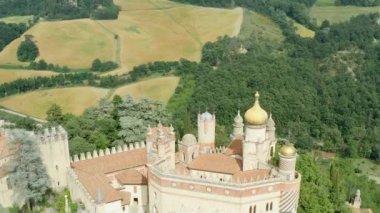 Aerial drone panoramic view of the Rocchetta Mattei castle in Italy on sunny summer day, view from above. High quality 4k footage