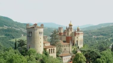 Aerial drone panoramic view of the Rocchetta Mattei castle in Italy on sunny summer day, view from above. High quality 4k footage