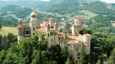 Aerial drone panoramic view of the Rocchetta Mattei castle in Italy on sunny summer day, view from above. High quality 4k footage
