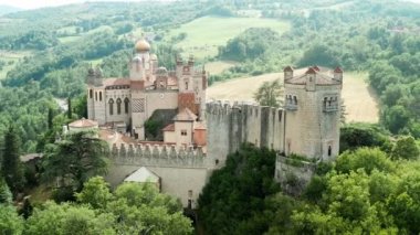Aerial drone panoramic view of the Rocchetta Mattei castle in Italy on sunny summer day, view from above. High quality 4k footage