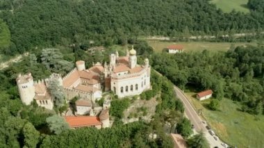 Aerial drone panoramic view of the Rocchetta Mattei castle in Italy on sunny summer day, view from above. High quality 4k footage