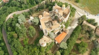 Aerial drone panoramic view of the Rocchetta Mattei castle in Italy on sunny summer day, view from above. High quality 4k footage