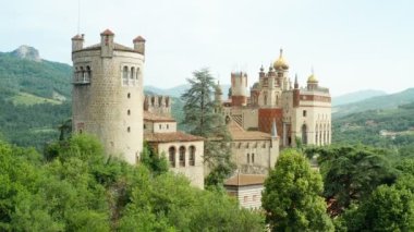 Aerial drone panoramic view of the Rocchetta Mattei castle in Italy on sunny summer day, view from above. High quality 4k footage
