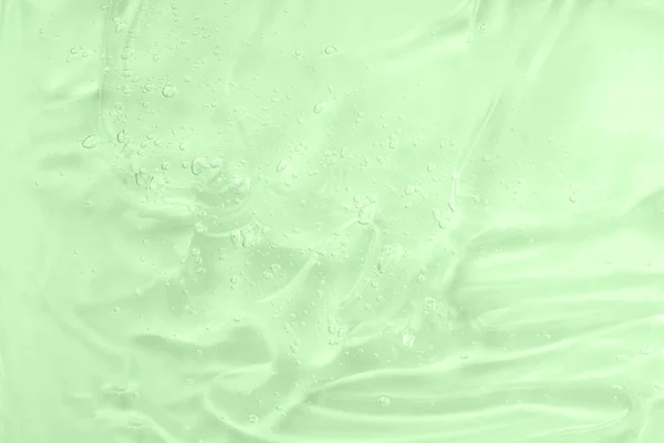 面部护肤清洁剂污迹 摘要化妆品质感背景 潮水绿色时尚质感 含维生素和芦荟的润肤剂 凝胶涂上一层泡沫 透明的美容产品 — 图库照片