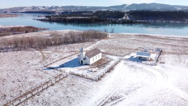 Alberta Alberta Canada, November 01 2021: Aerial spin of historic McDougall Memorial United Church during winter. — Stock Footage Alberta Alberta Canada November 2021 Aerial Spin Historic Mcdougall Memorial Stock Video