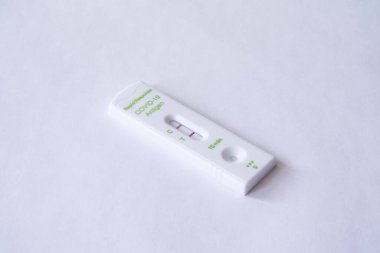 Calgary Alberta Canada, January 08 2022: A Covid 19 Positive rapid test result on a white background