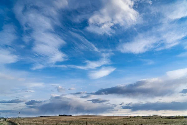 Dramatic big sky country scene on the Canadian prairies in Rocky View County Alberta Canada.