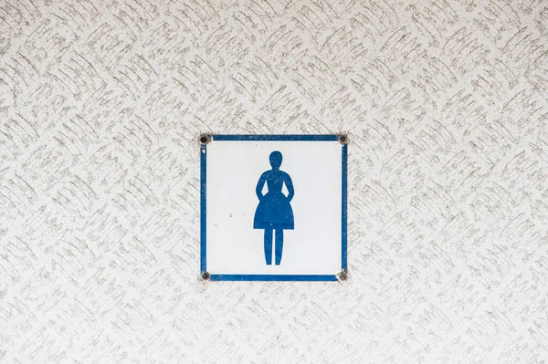Toilet sign for woman, Sweden