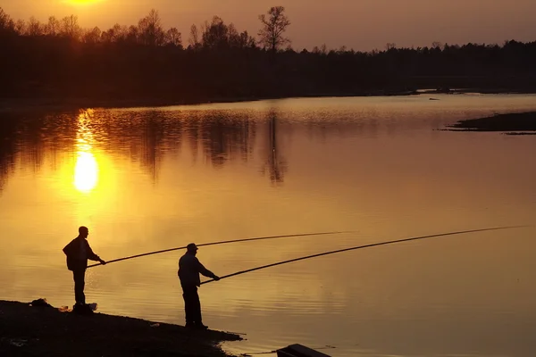 Two men fishing on river — Stock Photo, Image