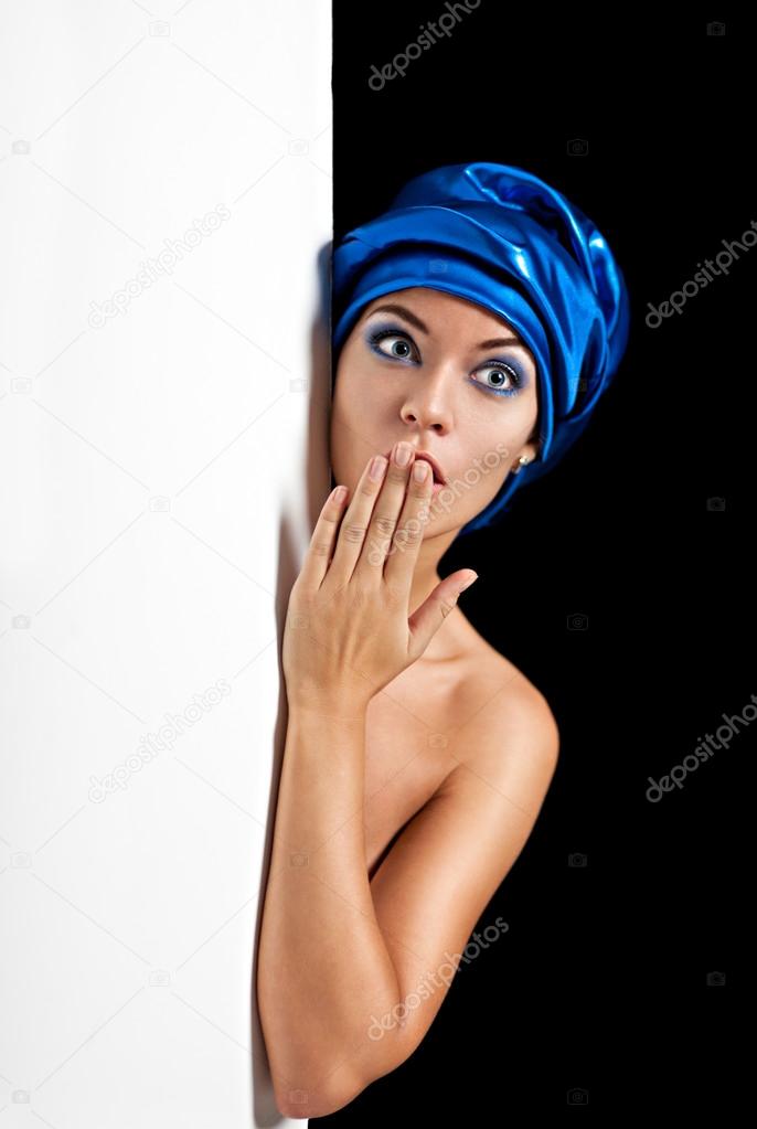 Surprised beautiful woman in  blue scarf