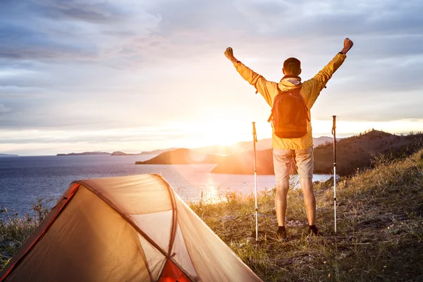 Backpacker in a camp