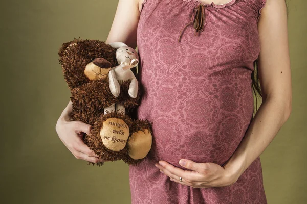 Embarazada con los juguetes —  Fotos de Stock