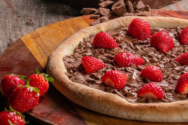 Brazilian sweet pizza with chocolate and strawberry clipart