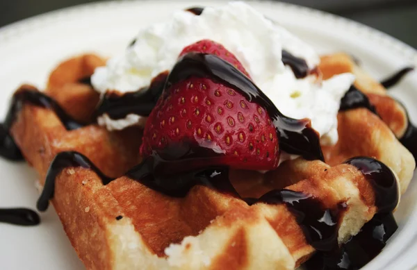 Liege waffle with strawberry, cream and chocolate sauce — Stock Photo, Image