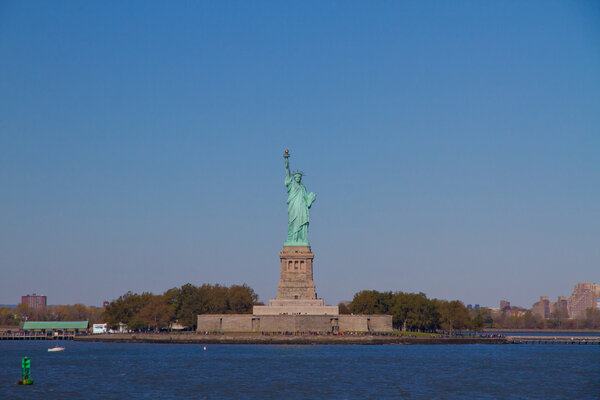 Liberty Statue holding the torch, standing on Liberty Island
