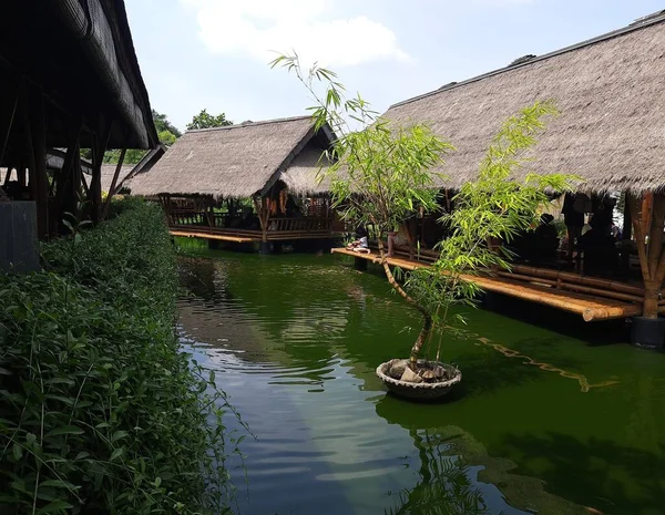 Traditional Asian wooden house on the lake. The floating village on the water