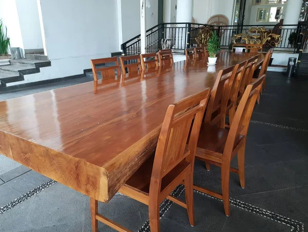 chair and big table from wood. Teak wood chairs and tables