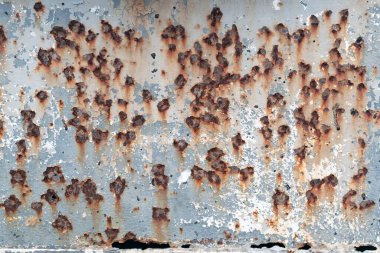 Metal levha üzerindeki pas izlerinin dokusu ve arkaplanı.