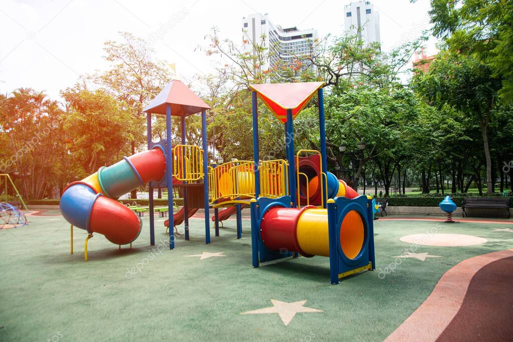Colorful playground made of plastic empty outdoor playground set playground equipment.  Play area. Garden equipment. Children's slide. Playground in the park.