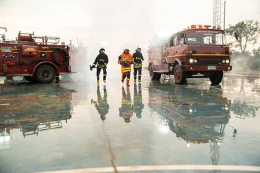 PHICHIT ,THAILAND - AUGUST 29 ,2020 : Unidentified firefighters were trained to help the man who had suffered a fire and passed out. Leave a lot of scorching and smoke.