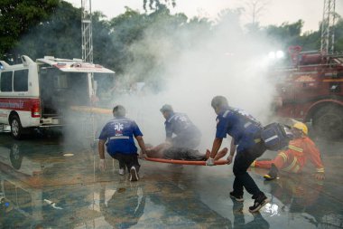 PICHIT , THAILAND - AUGUST 29 , 2020 : Unknown rescuers and fire brigade Conducting fire rescue drills by pulling wagons with the injured Put the ventilator in the throat and take him to the ambulance.