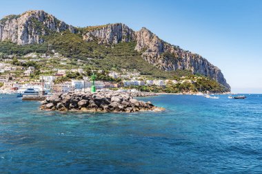 Entering the port of Capri with the famous town in the background