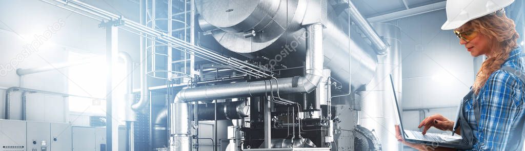 Engineer woman in working overalls with laptop inspect modern industrial gas boiler room. Heating gas boilers, pipelines, valves. Mixed media, panoramic view