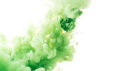 Diagonal splash of green paint in water against white background