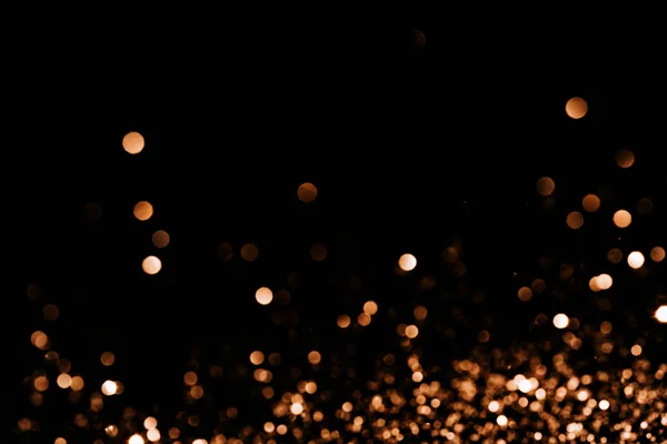 Bright sparks at the bottom of a black background — Stock Photo, Image
